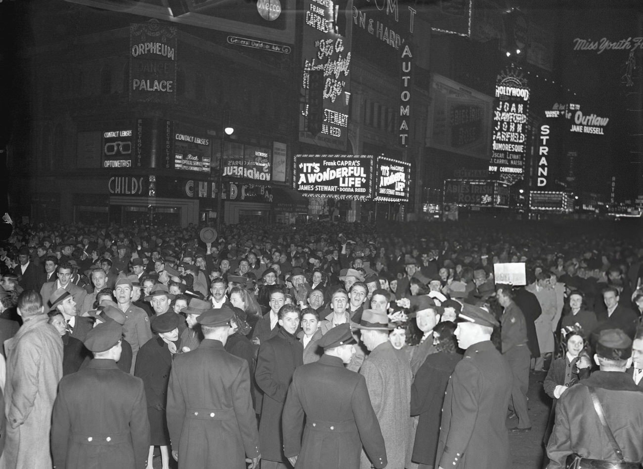 Cheering crowd in Times Square on New Year's Eve, New York City, 1946.