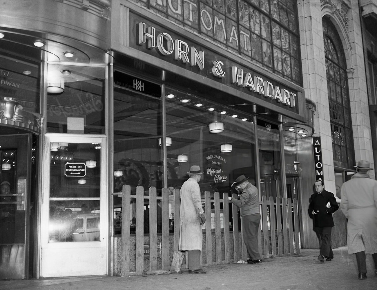 Fence erected at the Automat on Broadway in preparation for New Year's Eve crowds, New York City, 1946.