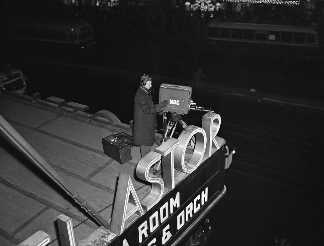 Cameraman recording the New Year's celebration in Times Square, New York City, 1946.