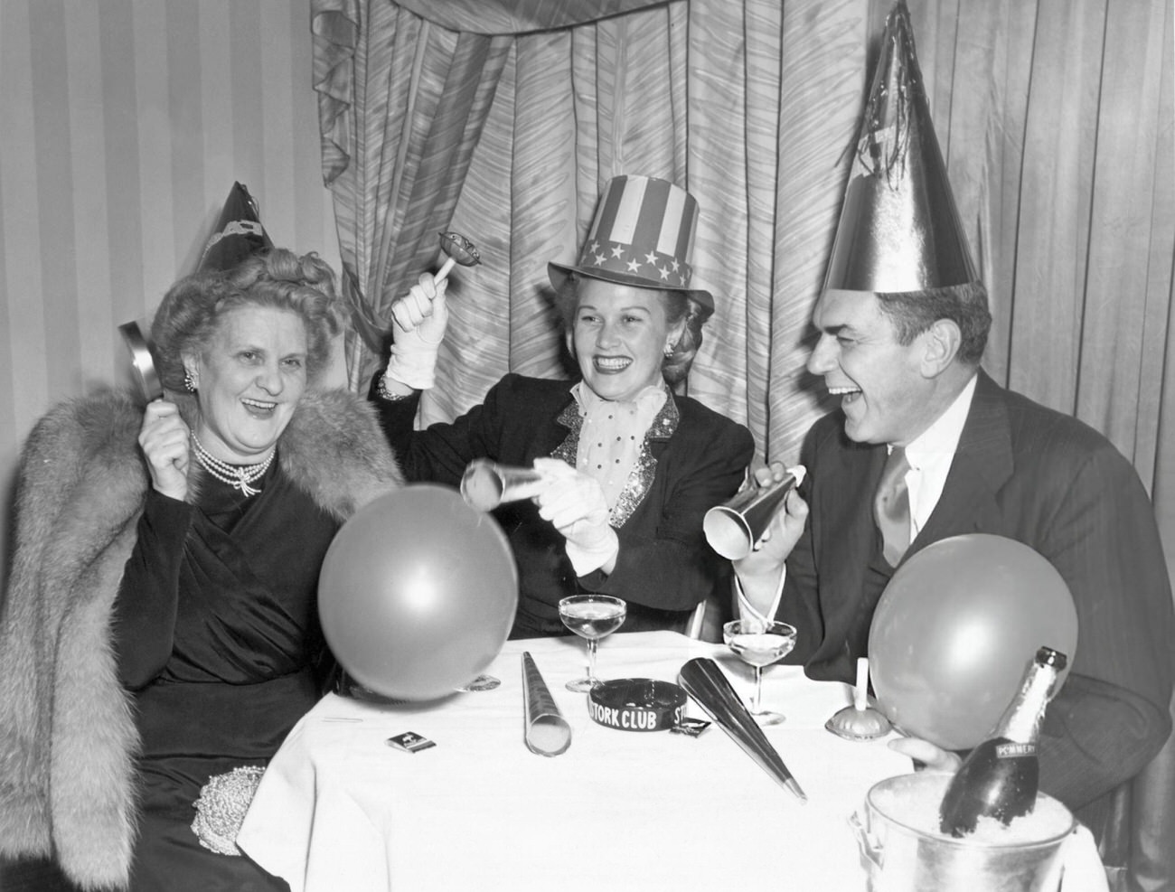 Joan Caulfield with her parents at the Stork Club, New York City, 1946.