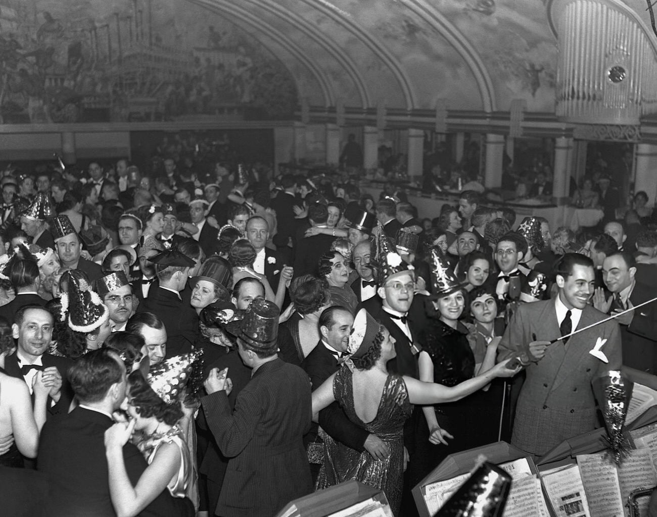 Cab Calloway leading his orchestra at a New Year's Ball at the Cotton Club, New York City, 1937.