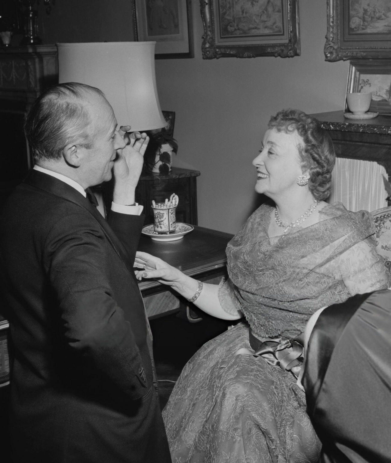 Cecil Beaton and Millicent Hearst at Gilbert and Kitty Miller's New Year's Eve party, New York City, 1952.