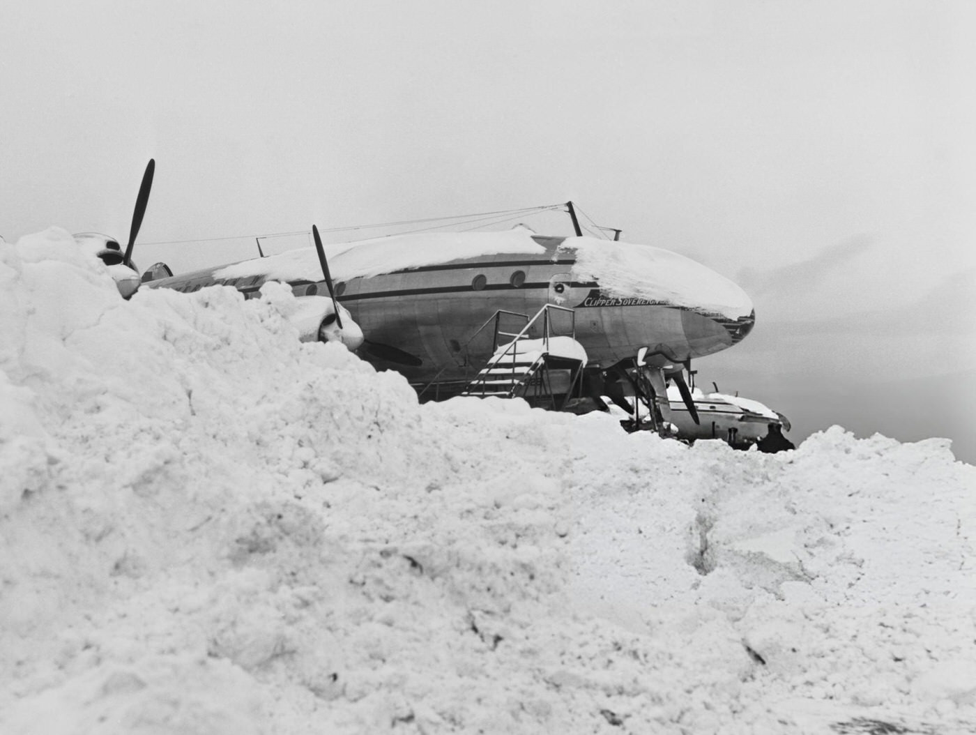 A Pan-American passenger plane marooned in snow at LaGuardia Airport during the Great Blizzard of 1947, New York City, 1947.