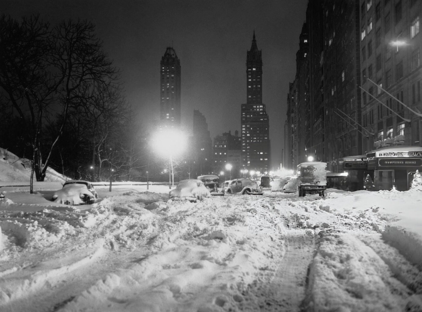 Cars abandoned on snow-covered roads outside the Hampshire House hotel in Manhattan, New York City, during the Great Blizzard of 1947, 1947.