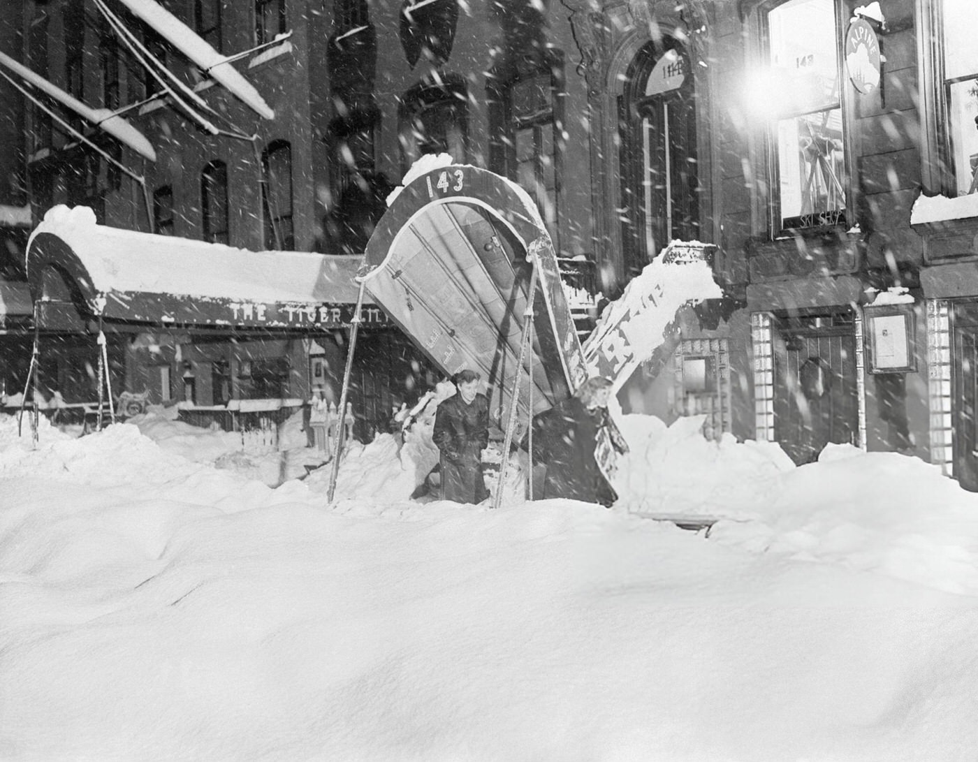 Restaurant awning collapsed from snow during the record snow storm on 45th St, New York, 1947.