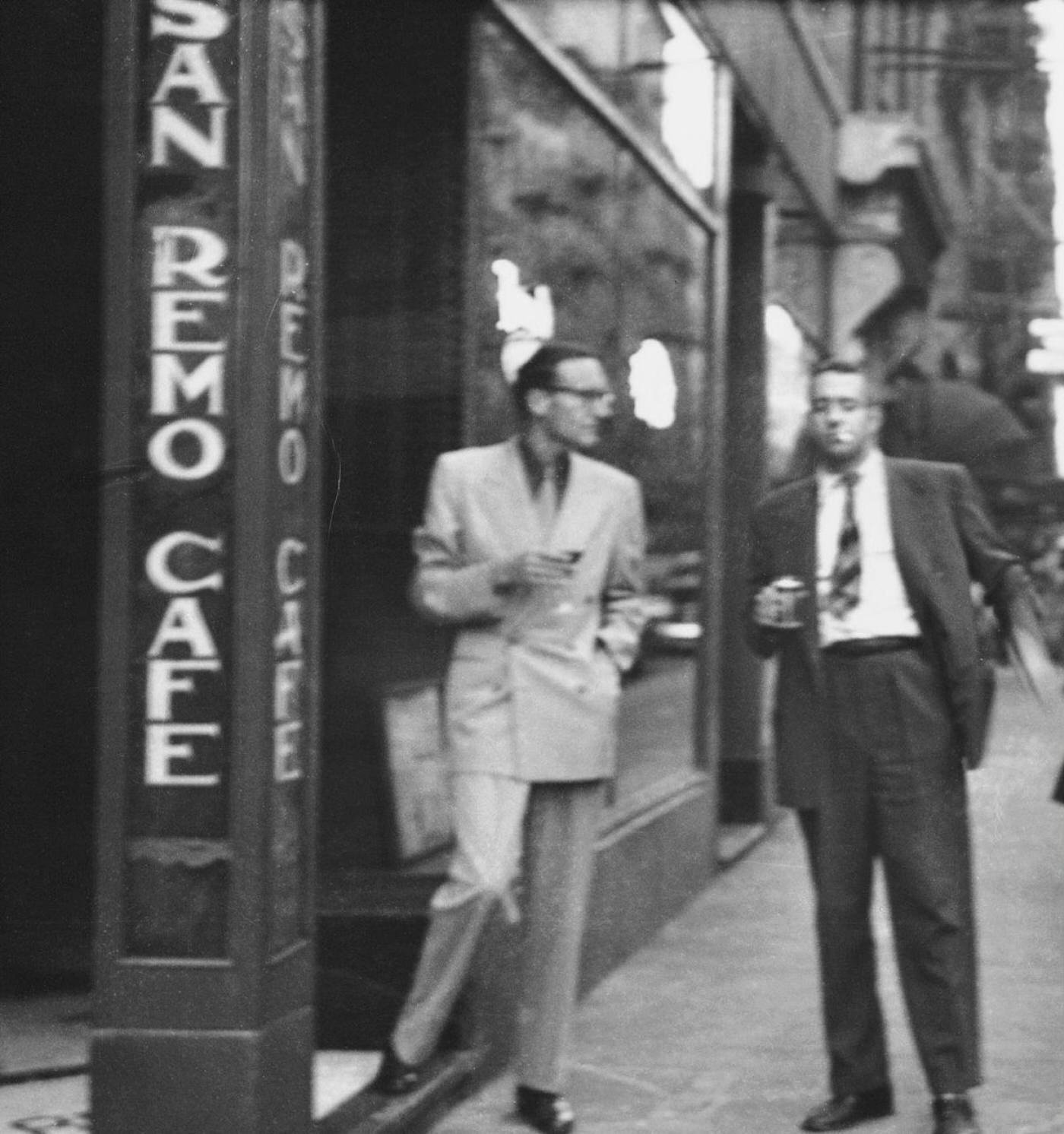 Writer William S. Burroughs and Poet Alan Ansen chat outside the San Remo Cafe in Greenwich Village.