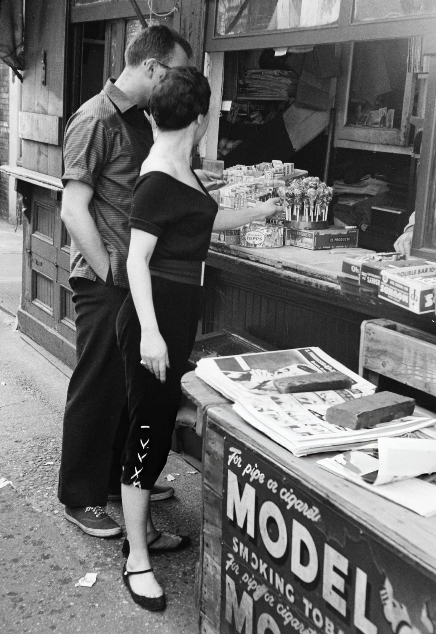 A street kiosk advertising Model smoking tobacco in Greenwich Village, 1954.