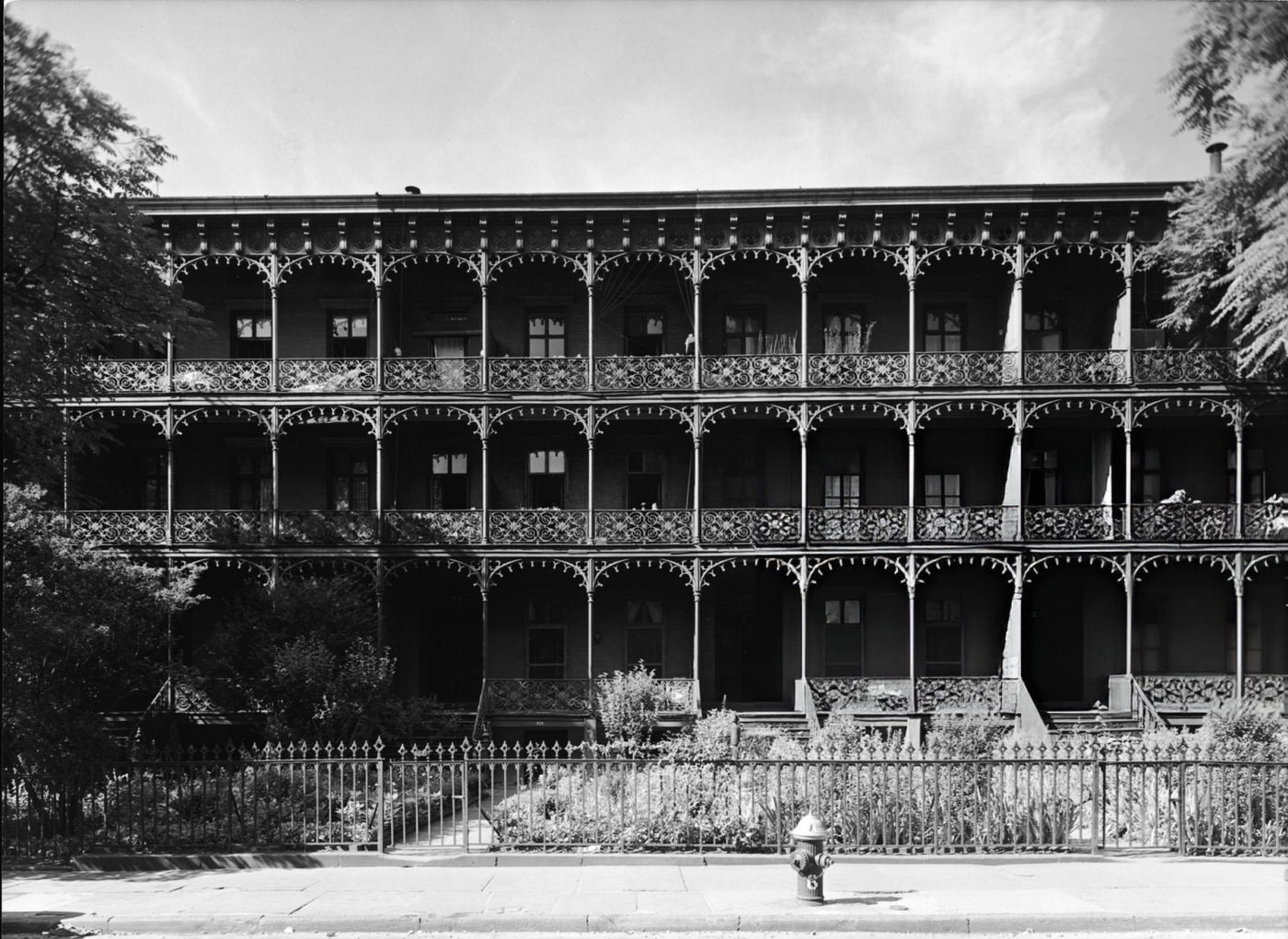 11th Street with a Series S 'O'Brien' fire hydrant in front of Rhinelander Gardens houses in Greenwich Village, mid 20th Century.