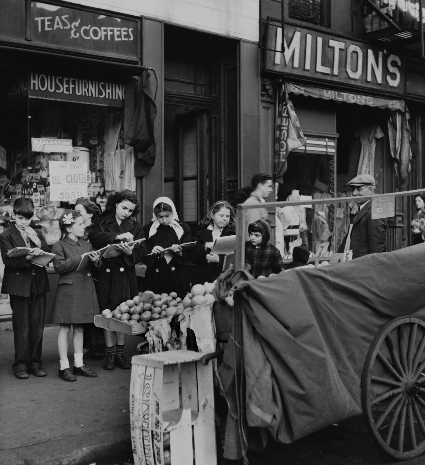 Children from the NY Greenwich House Children's Art Workshop sketch a greengrocer's stall in Greenwich Village, 1950s.