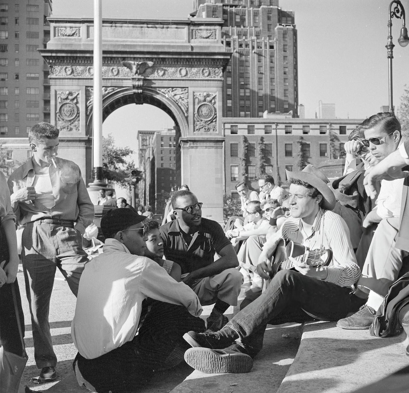 People listening to folk singer Ramblin' Jack Elliott in Washington Square, 1954.