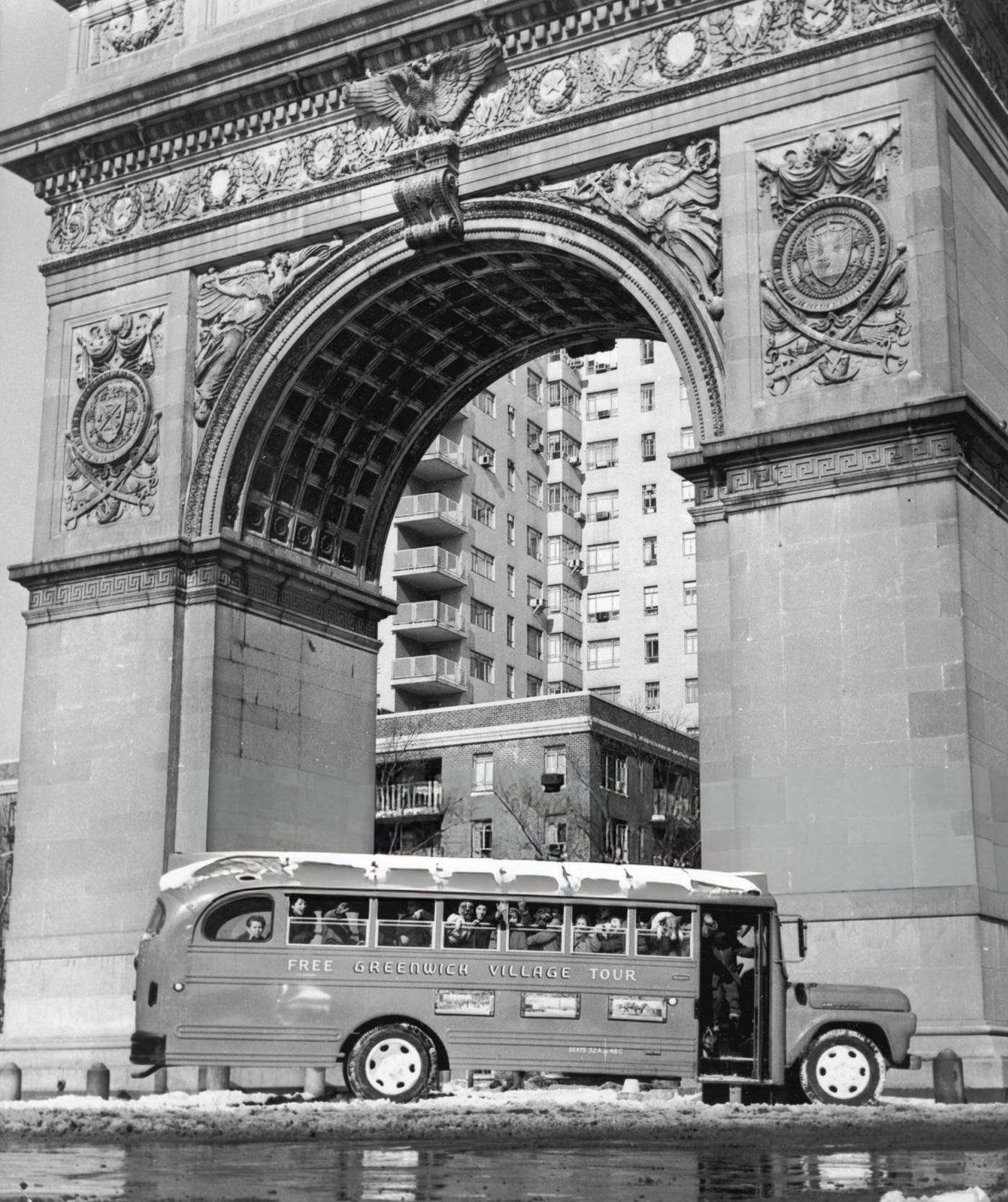 A Greenwich Village tour bus parked at the base of the Washington Arch, 1955.