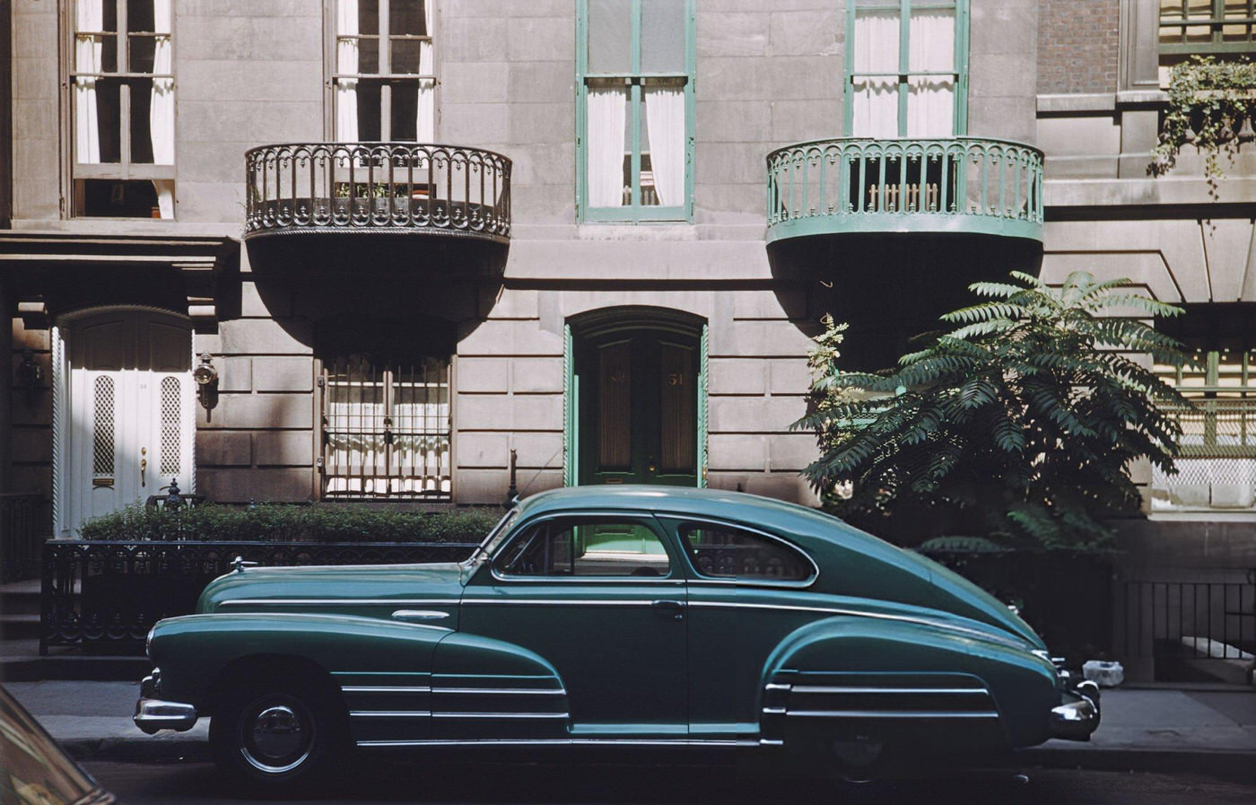 A car parked outside a house in Greenwich Village, 1953.