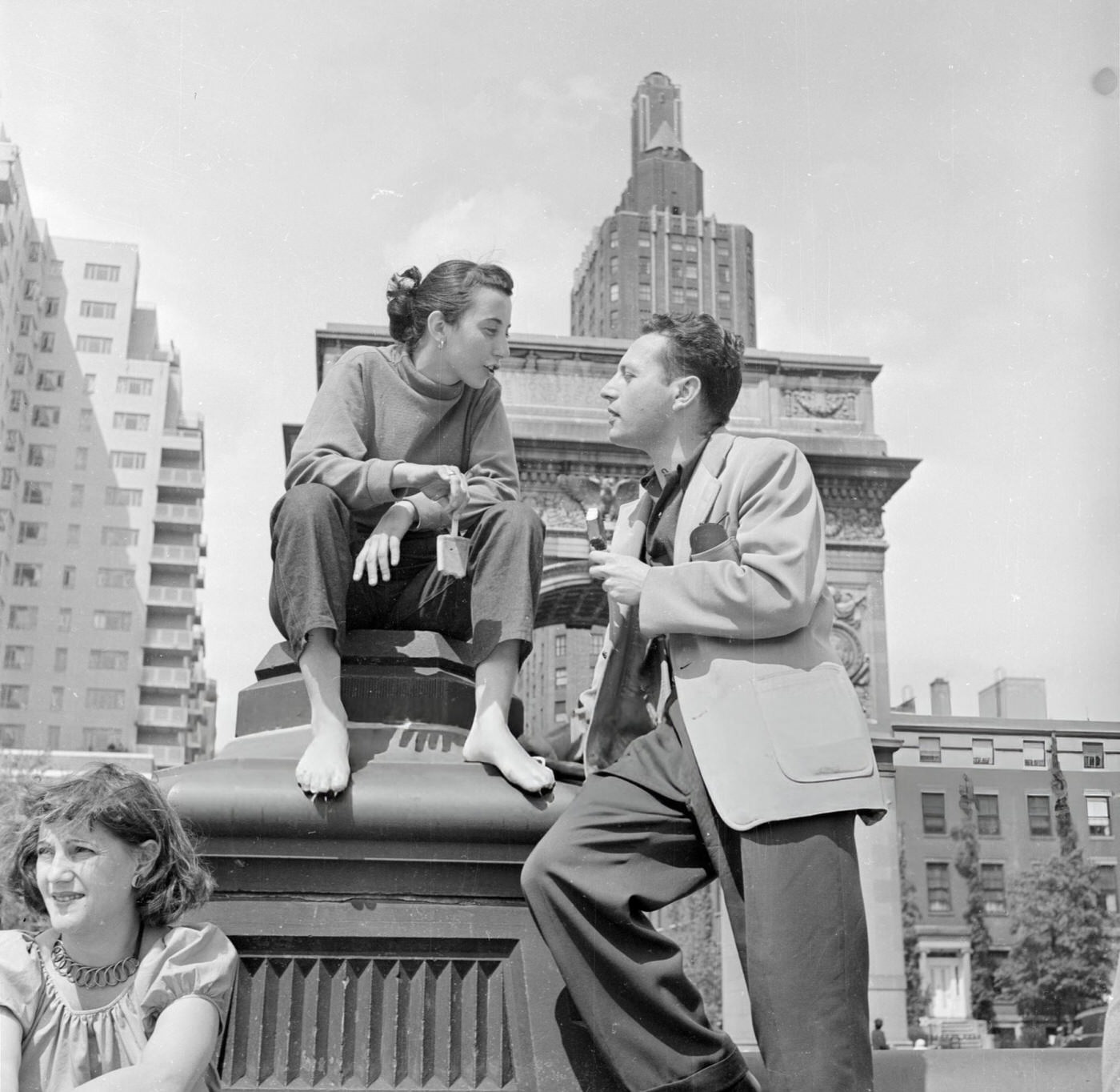 A young couple in conversation in Washington Square, 1952.