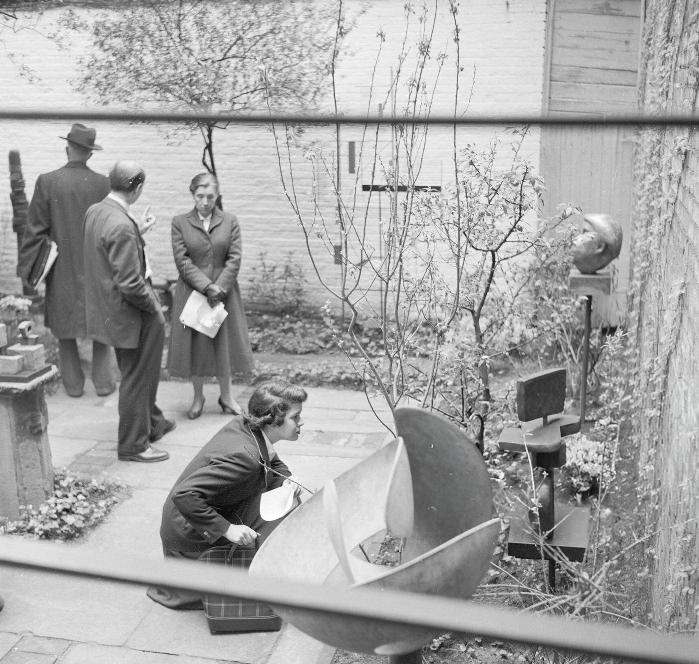 A domestic garden as an art gallery in Greenwich Village, 1955.