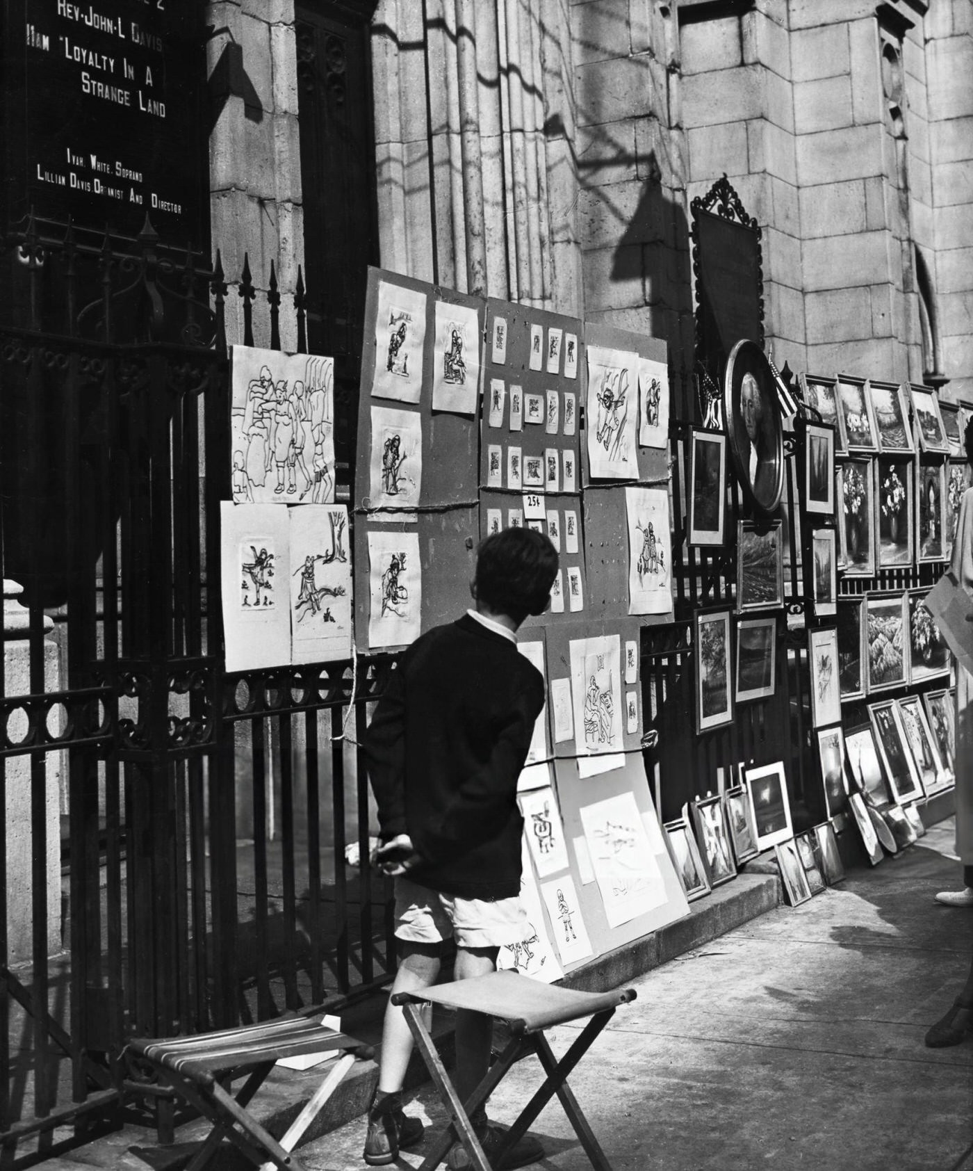 Artworks displayed at a sidewalk art exhibition near Washington Square, 1955.