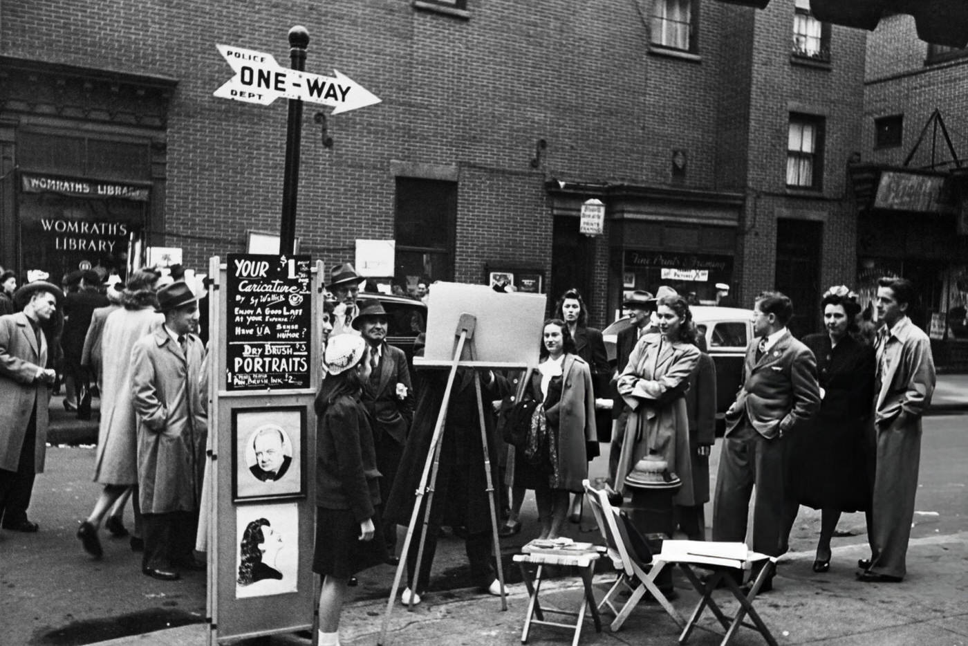 People watch an artist painting a portrait in Greenwich Village, 1955.