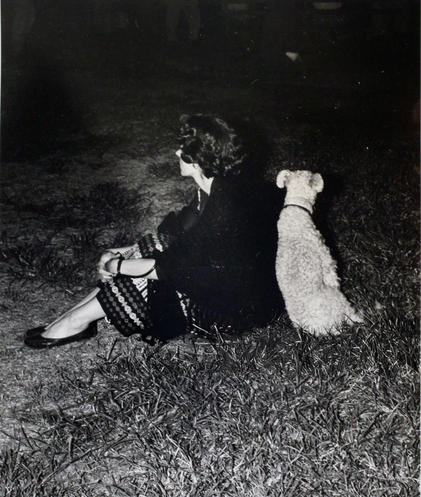 A woman and her dog at an outdoor jazz concert in Washington Square Park, 1956.