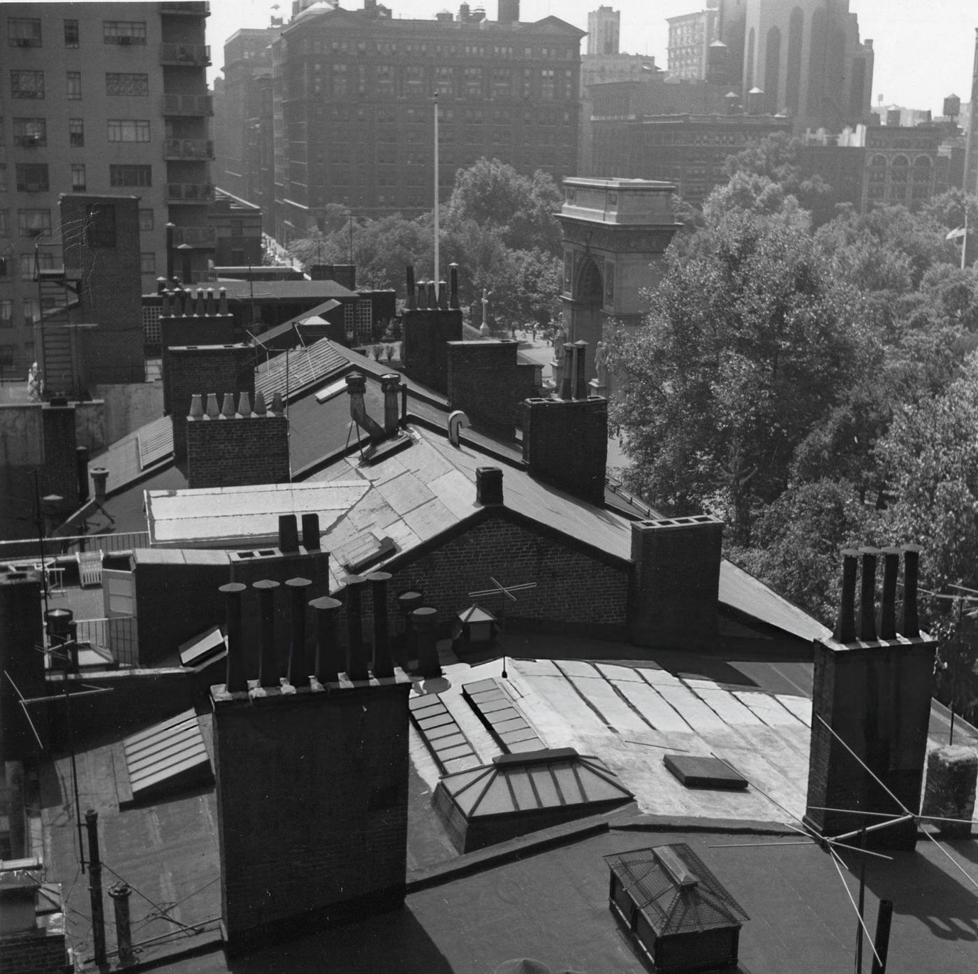 Rooftops of MacDougal Alley with Washington Square Arch in the background, 1954.