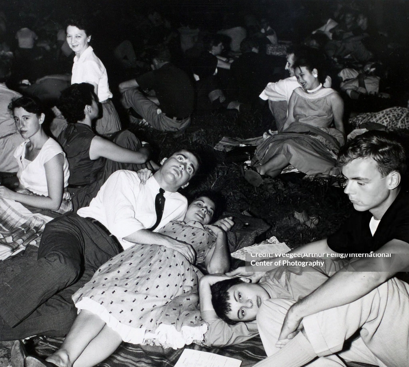 Fans attend a night concert in Washington Square Park, 1950s.