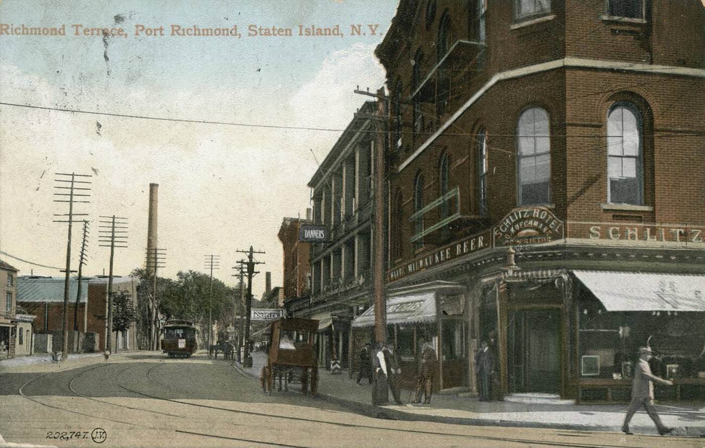 Richmond Terrace, Port Richmond, Staten Island, featuring a trolley, horse-drawn carriage, and the Schlitz Hotel, 1900.