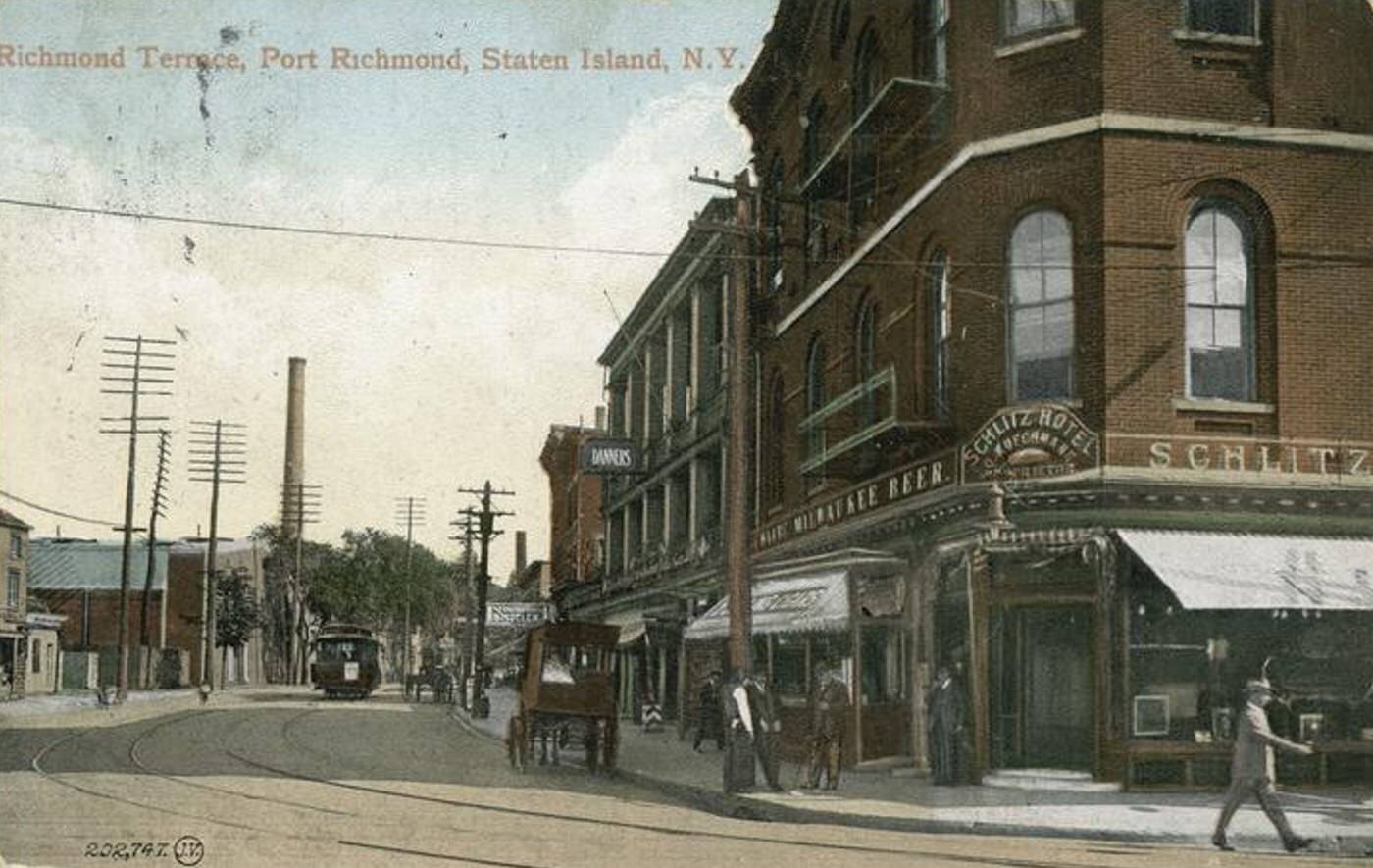 Richmond Terrace, Port Richmond, featuring a trolley, horse-drawn carriage, the Schlitz Hotel, 1900s.