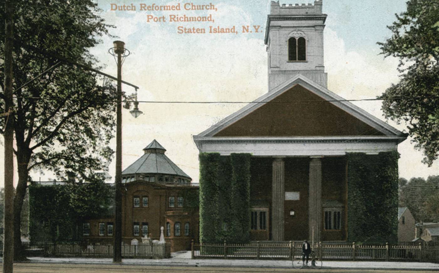 Dutch Reformed Church, Port Richmond, featuring a man and bicycle in front, 1900s.