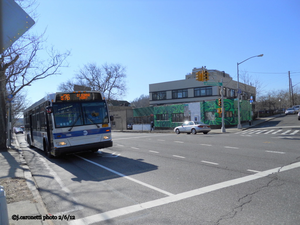 NYCTA No. 7086 working route S76 at Bay Street & Slosson Terrace, 2012.