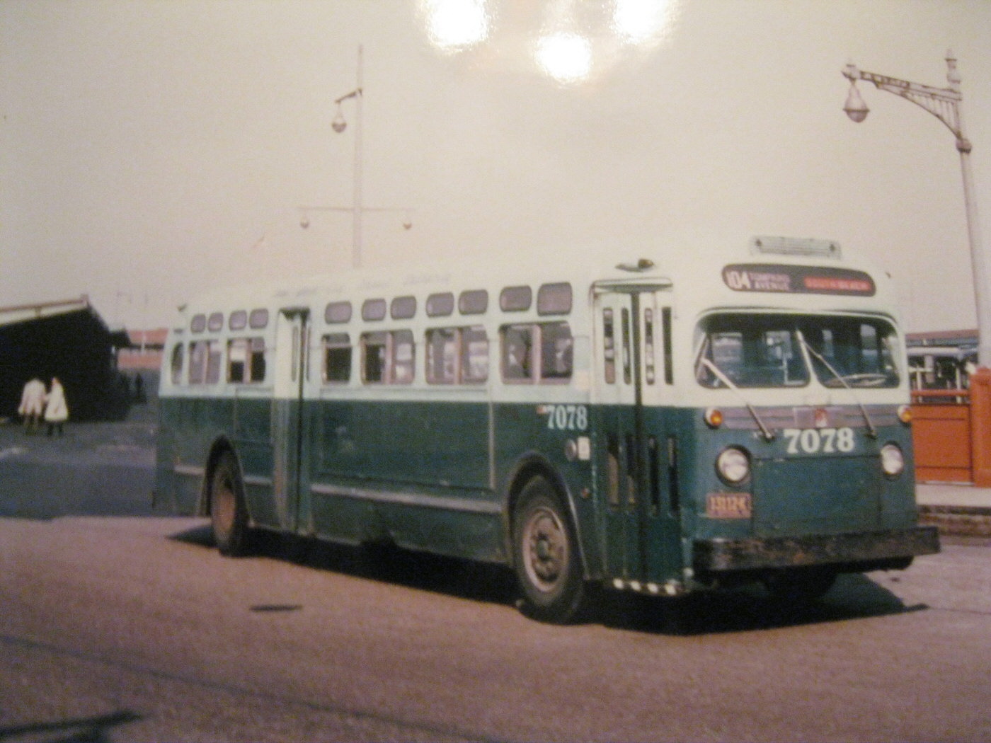 NYCTA No. 7078 working route R104 at the St. George Ferry Terminal.
