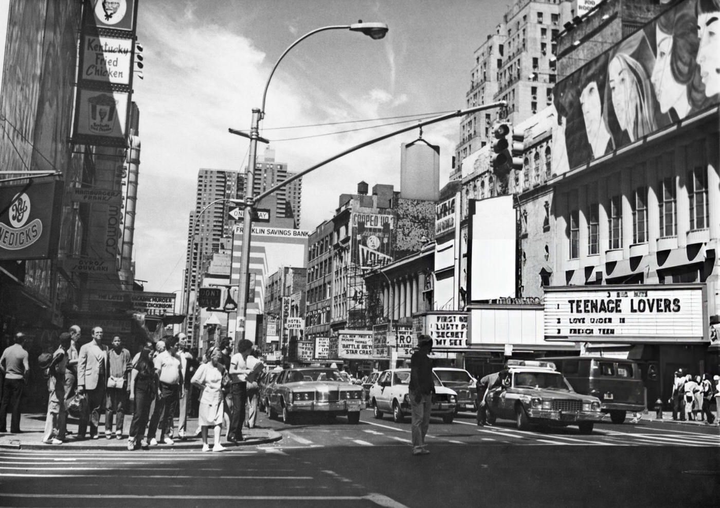 Pedestrians and traffic on West 42nd Street in Midtown Manhattan , 1980.