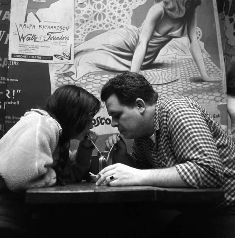 A couple share a soda at the Cock N' Bull on Bleecker Street, 1959.