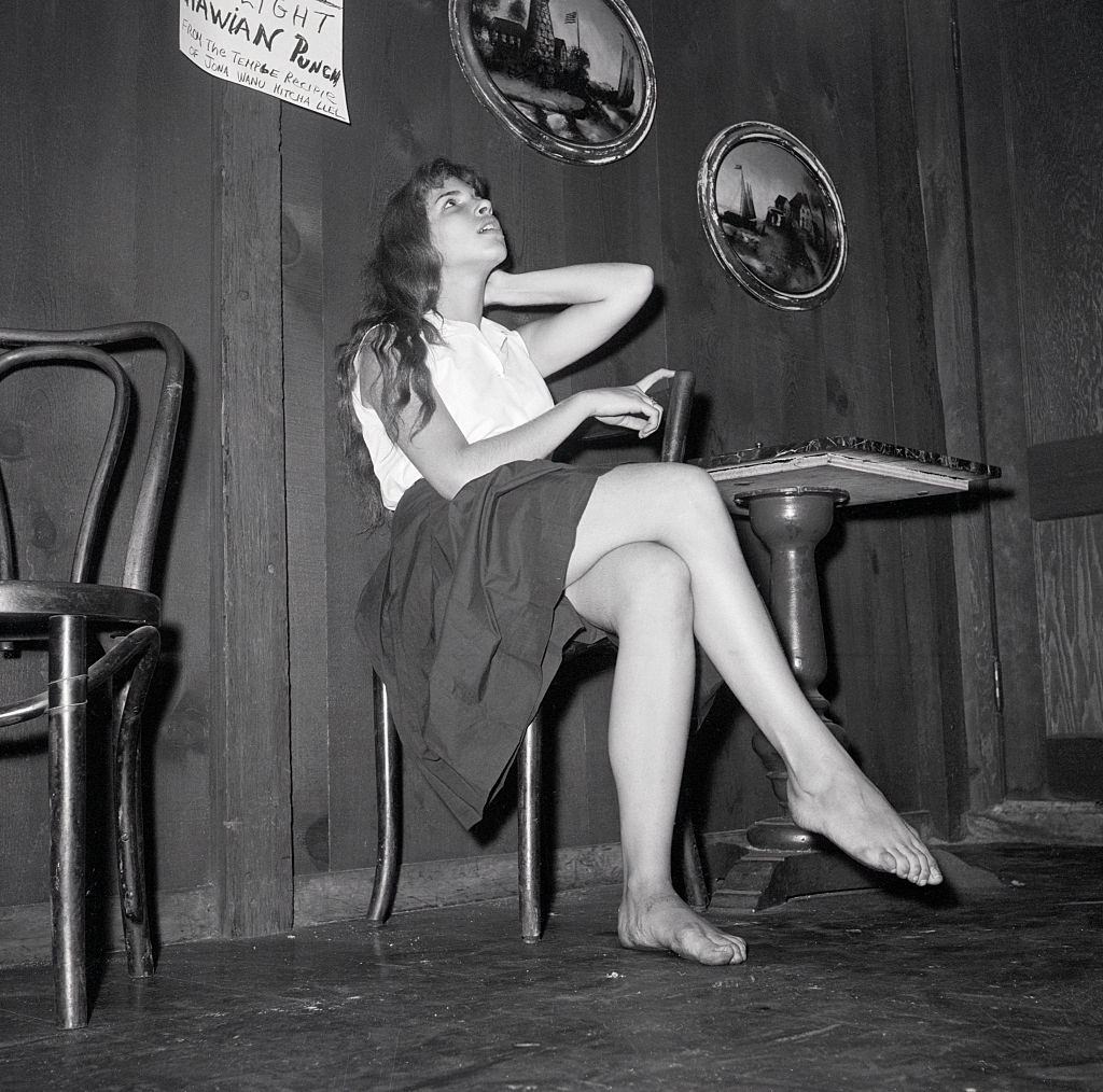 Miss Beatnik poses in the Gaslight coffee house, 1959.