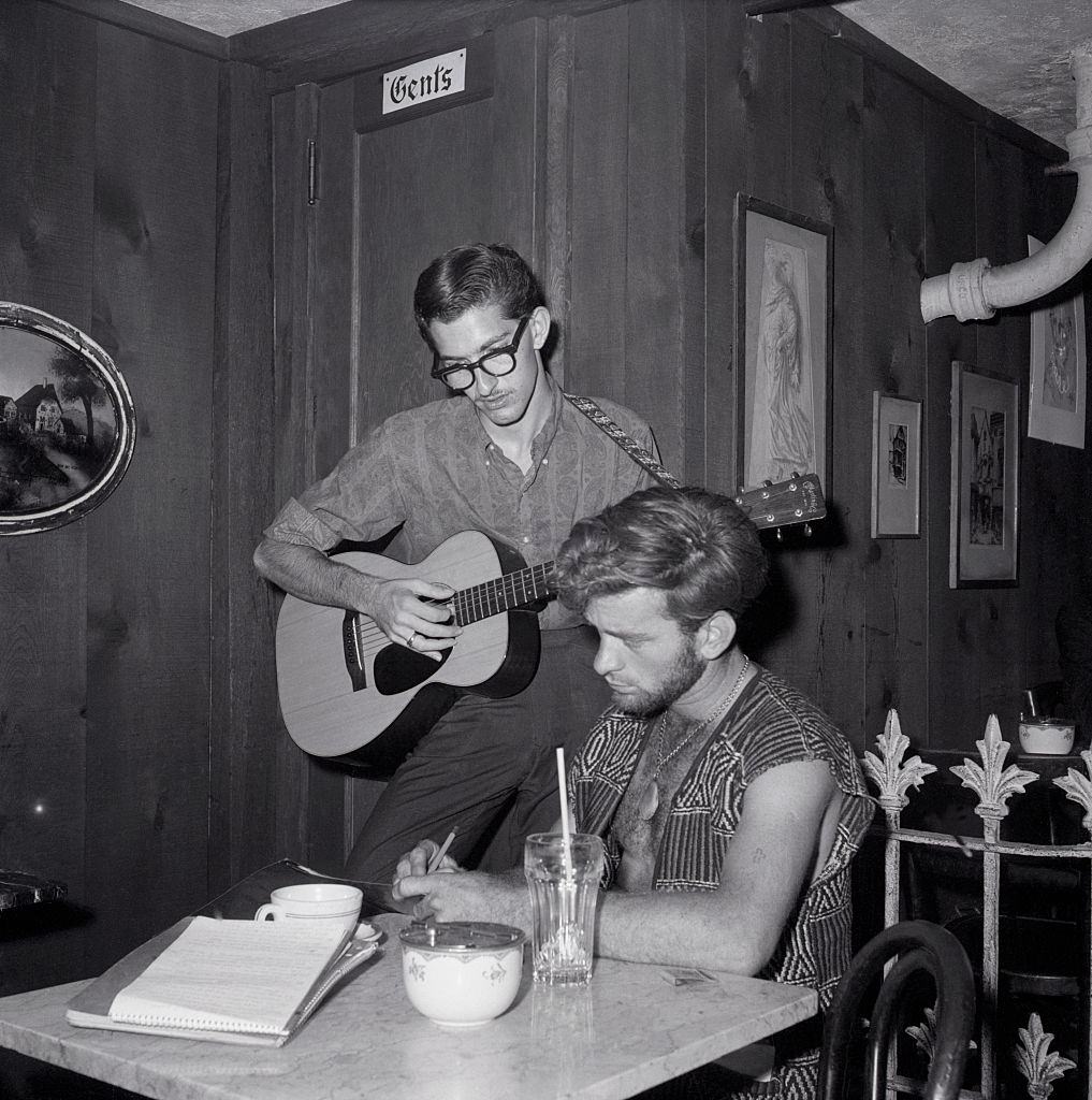 Beatnik playing guitar in Cafe, 1959.