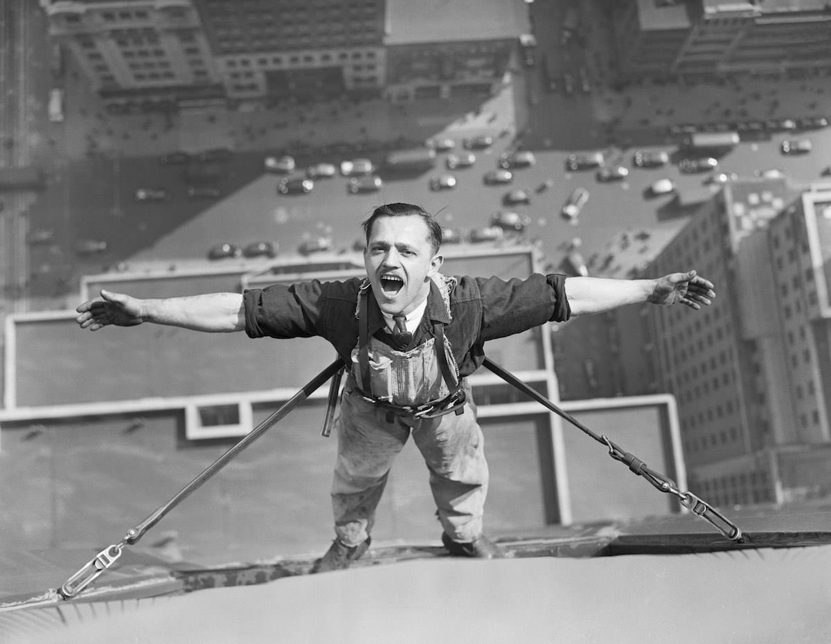 A window washer on the Empire State Building pauses to take a breath, 1936.