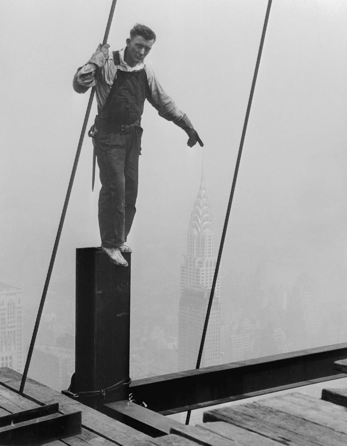 A steelworker's finger on the Chrysler Building seen from the Empire State Building, 1930.