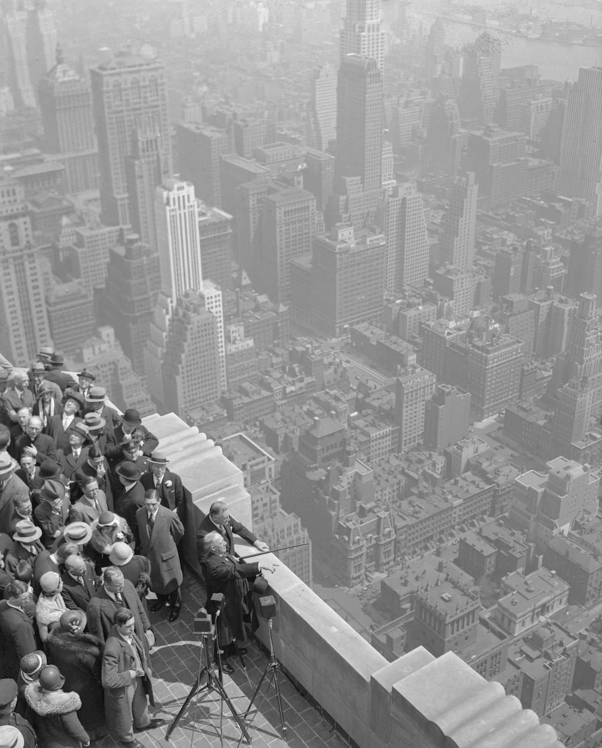 Ex-Governor Alfred E. Smith, Governor Franklin D. Roosevelt, and others at the top of the Empire State Building after its official opening, 1931.