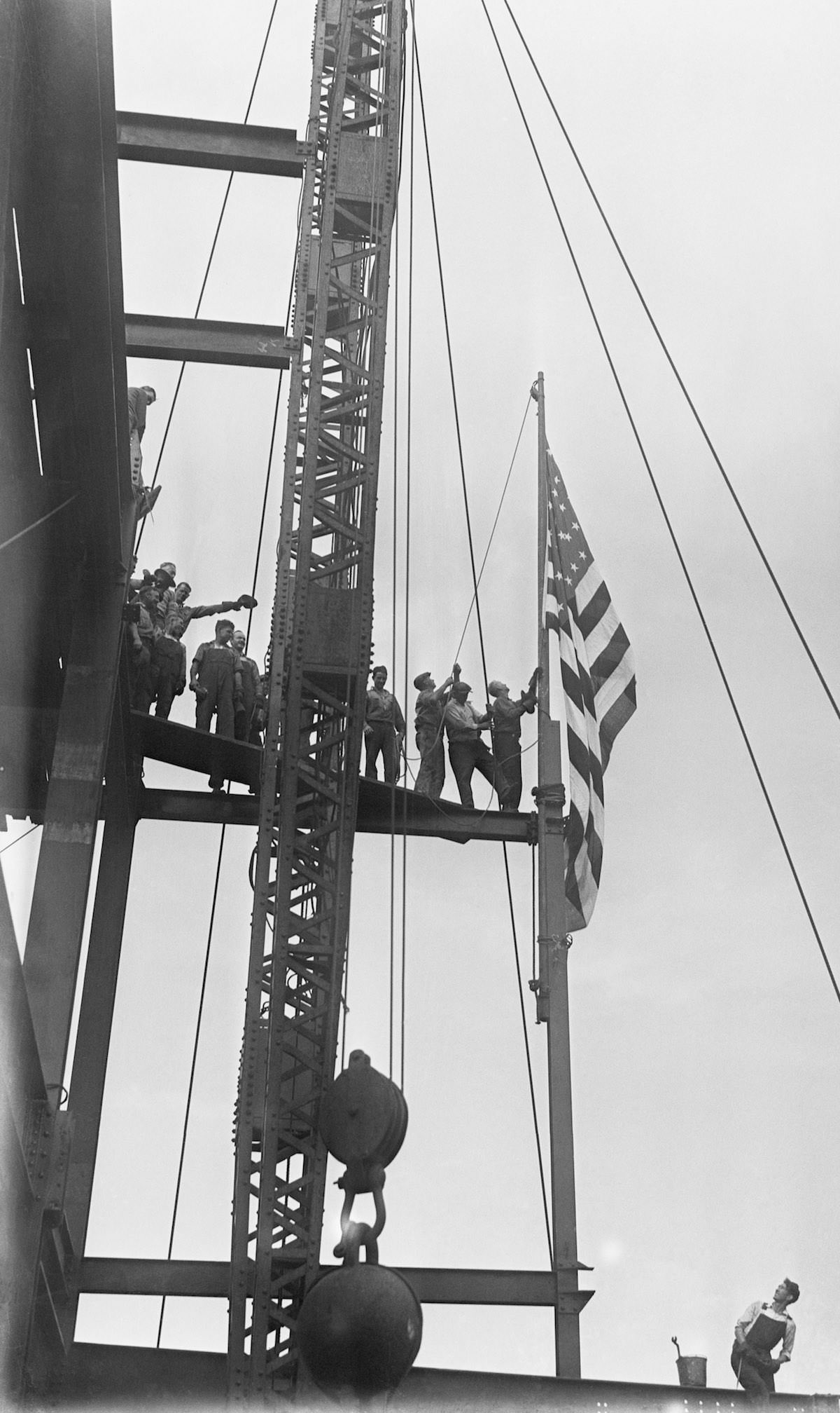 Workmen at the new Empire State building being erected on the site of the old Waldorf Astoria Hotel, 1930.