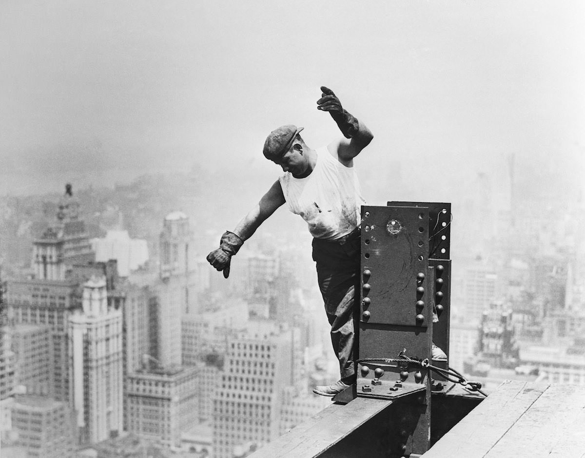 Steel workers arrange the steel frame for the Empire State Building, 1930.