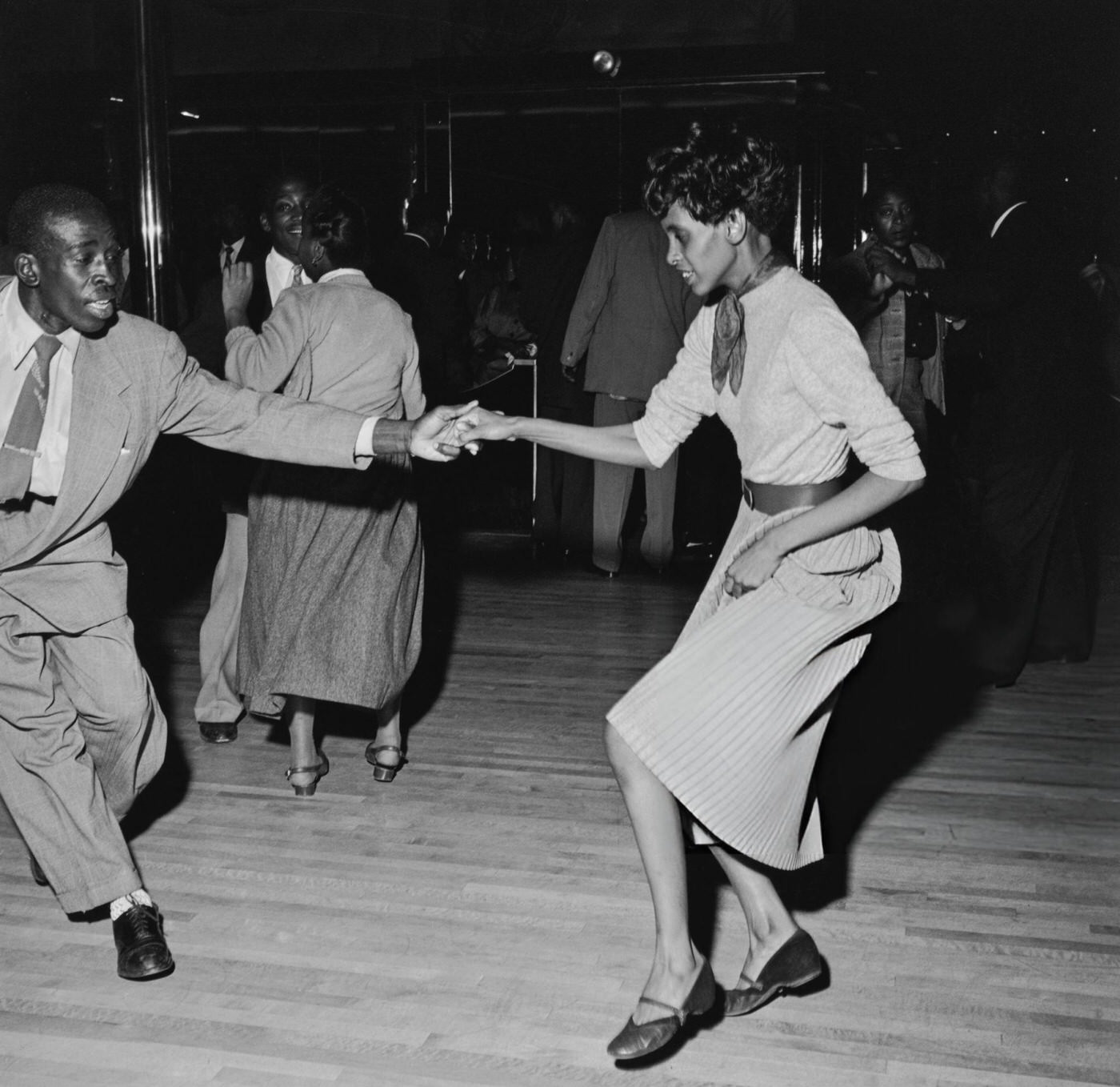 Americans showing off their 'Swing' dance moves at the Savoy Ballroom in Harlem, 1947.