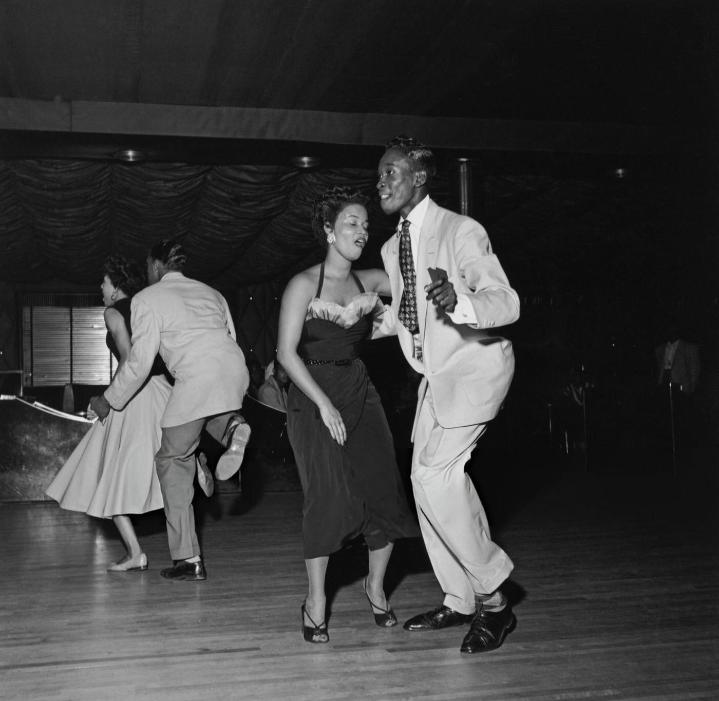 Americans showing off their 'Swing' dance moves at the Savoy Ballroom in Harlem, 1947.