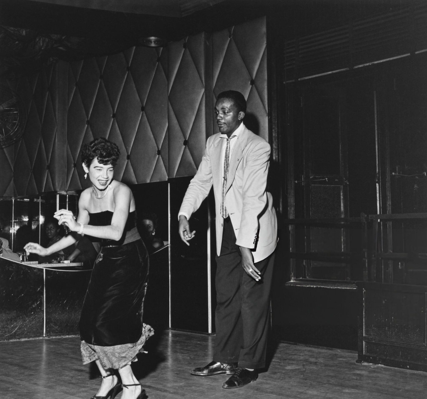 Americans showing off their 'Swing' dance moves at the Savoy Ballroom in Harlem, 1947.