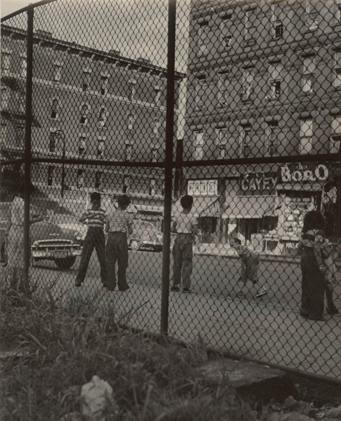 Children playing along Madison Avenue, East Harlem, 1940s.