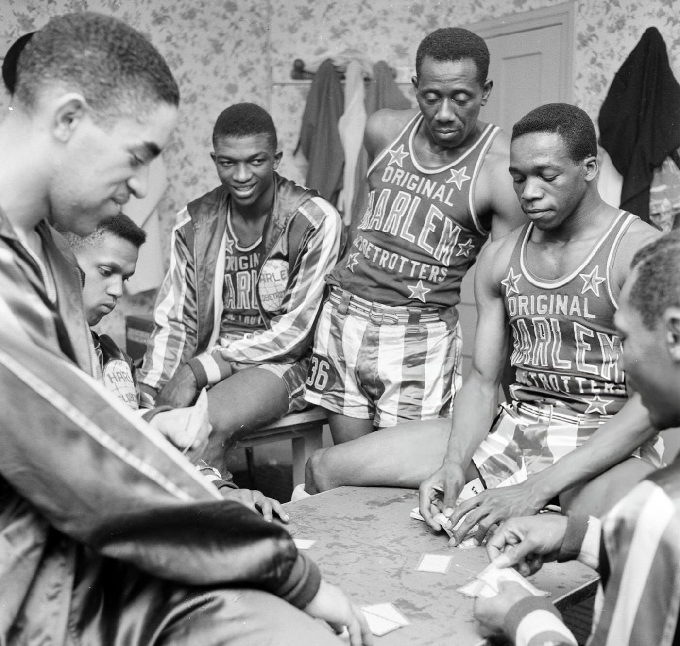 The Harlem Globetrotters playing cards before an exhibition match, 1940s.