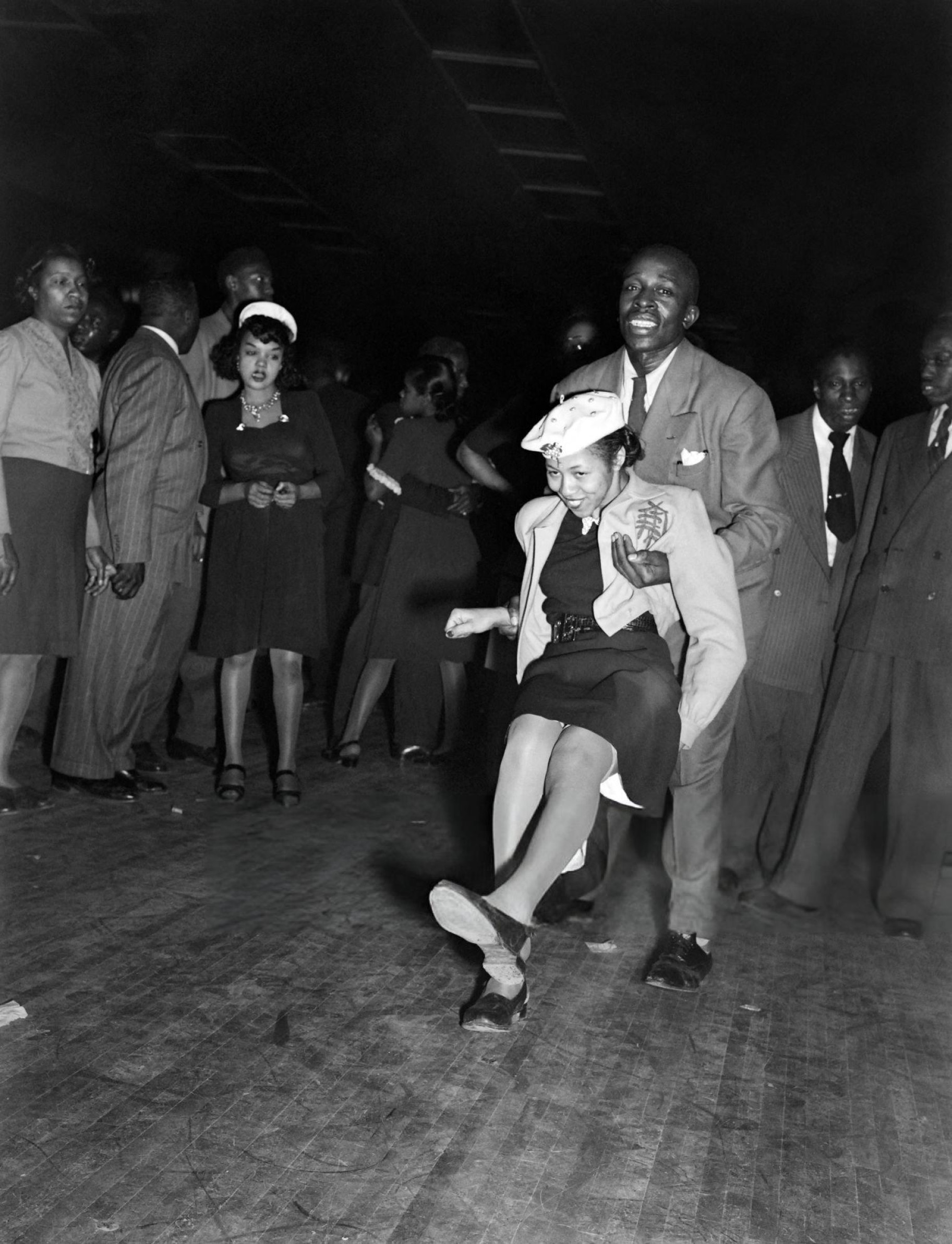 People dance in a night club of Harlem, 1940s.
