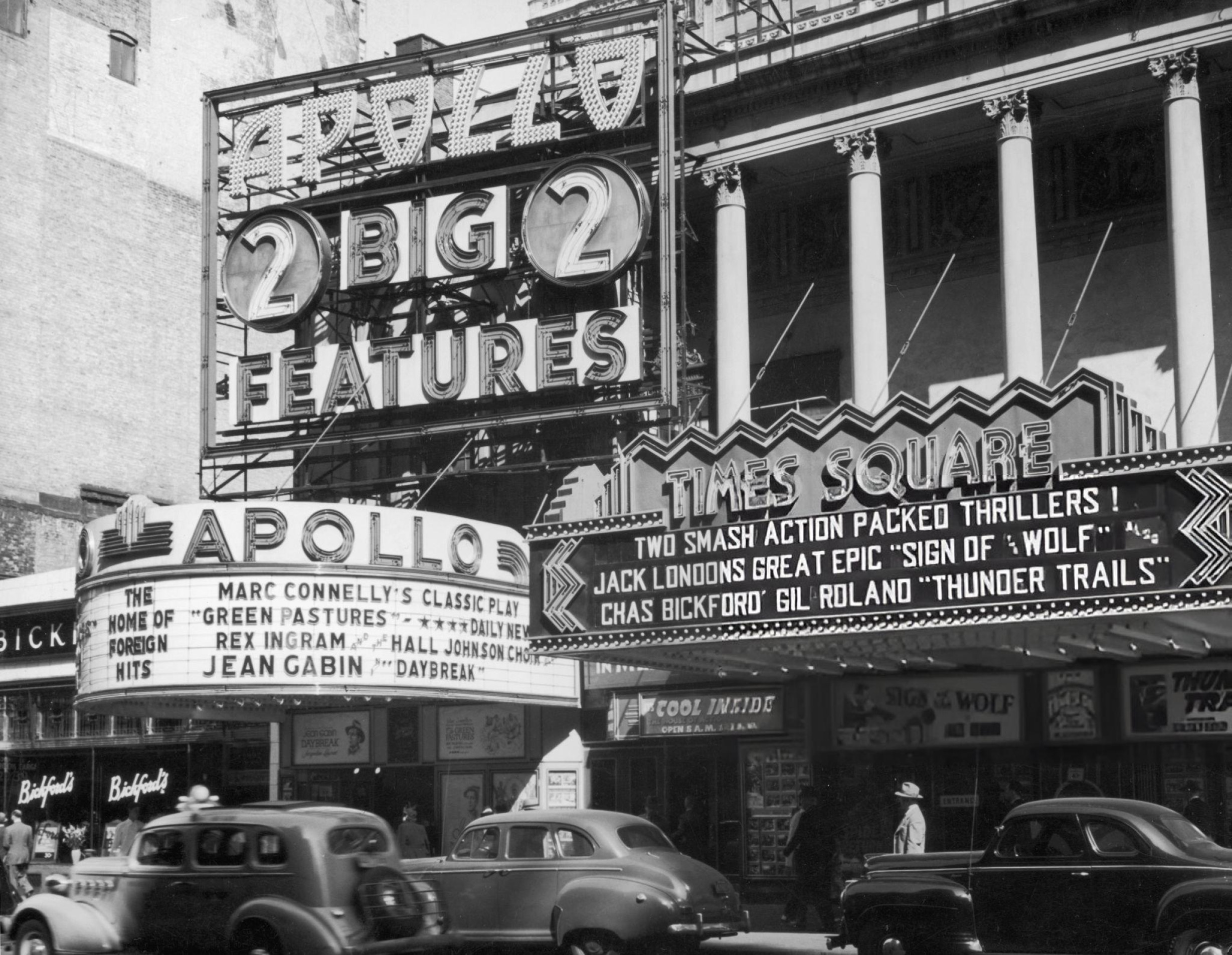 The marquees of the Apollo and Times Square theaters in midtown New York City, 1941.
