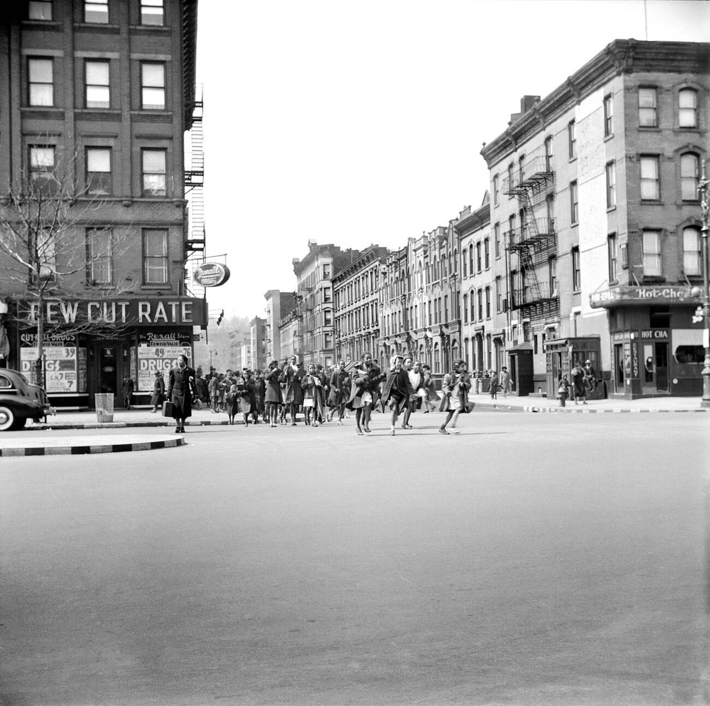 Schoolchildren crossing street, Harlem, 1943.