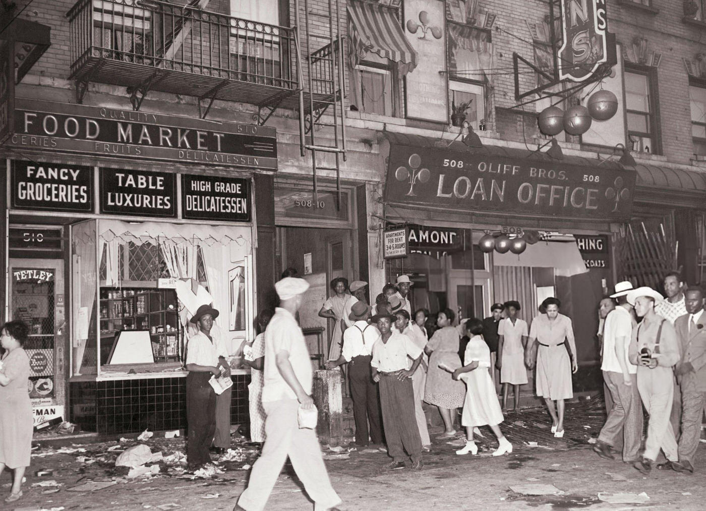 Riots in Harlem, crowds in front of shattered store windows, 1943.