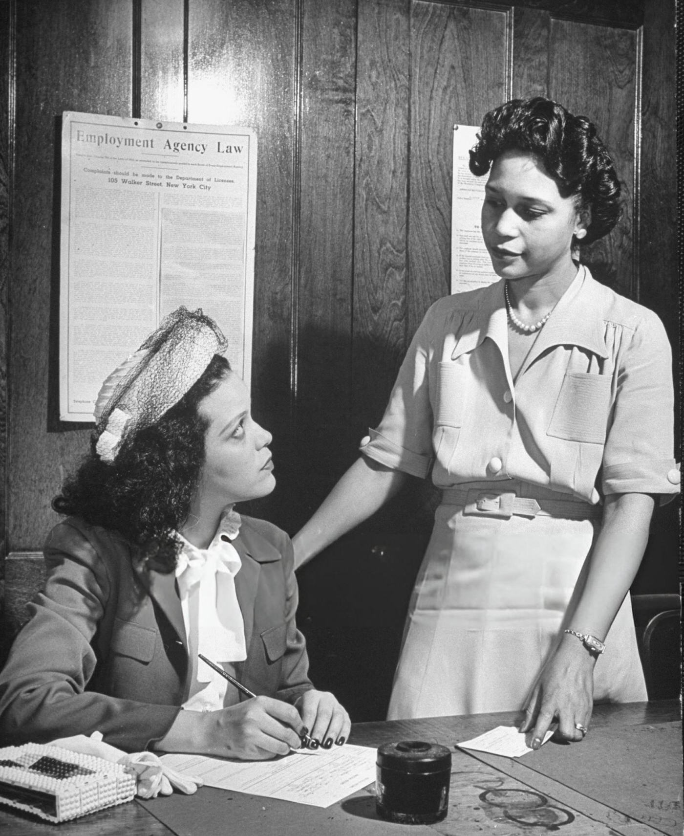 Hilda Simms, African American actress, talking with an employment head of the Harlem employment division of YWCA, 1940s.