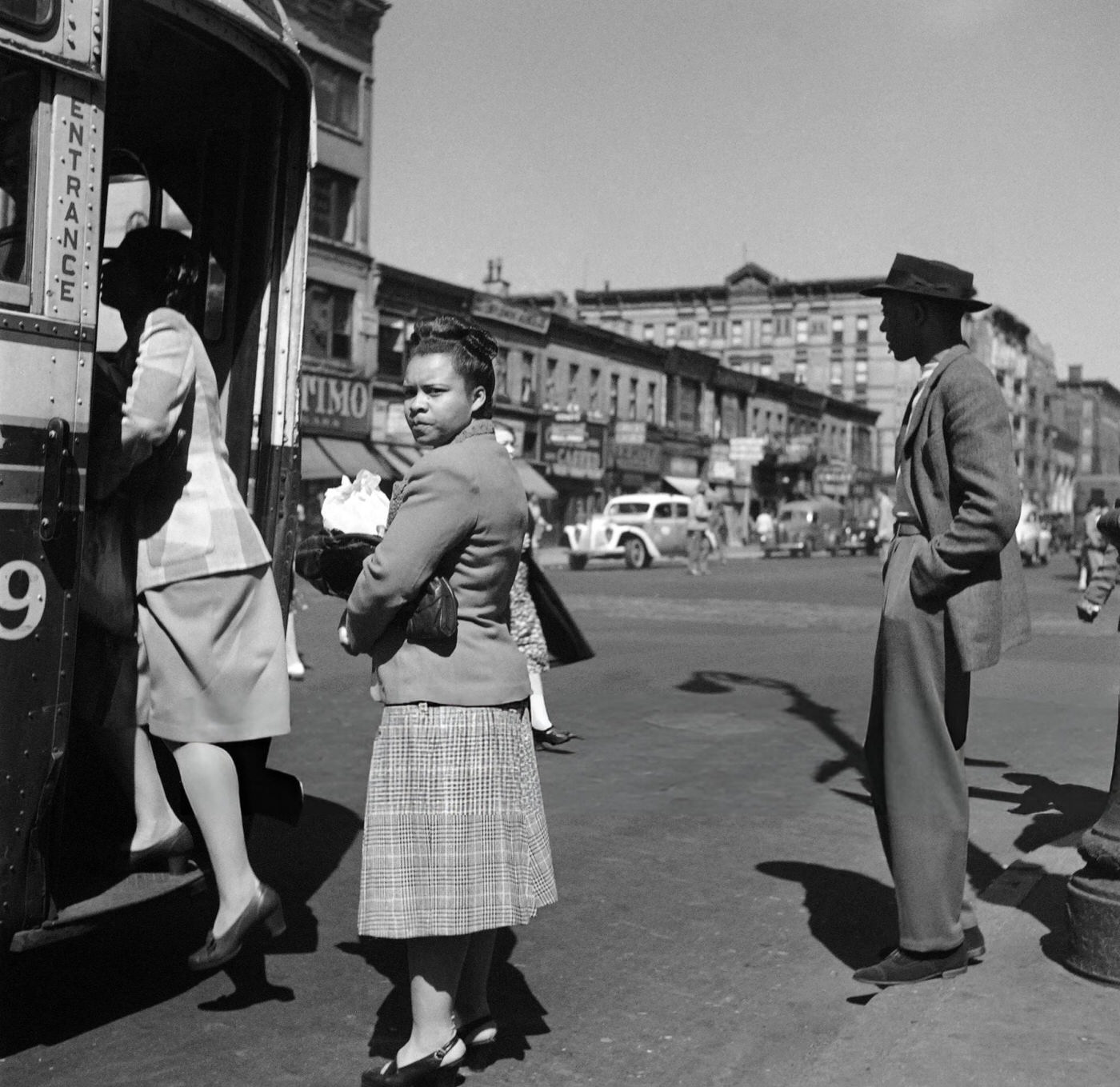 African American people get on a bus in Harlem, Manhattan, 1946.