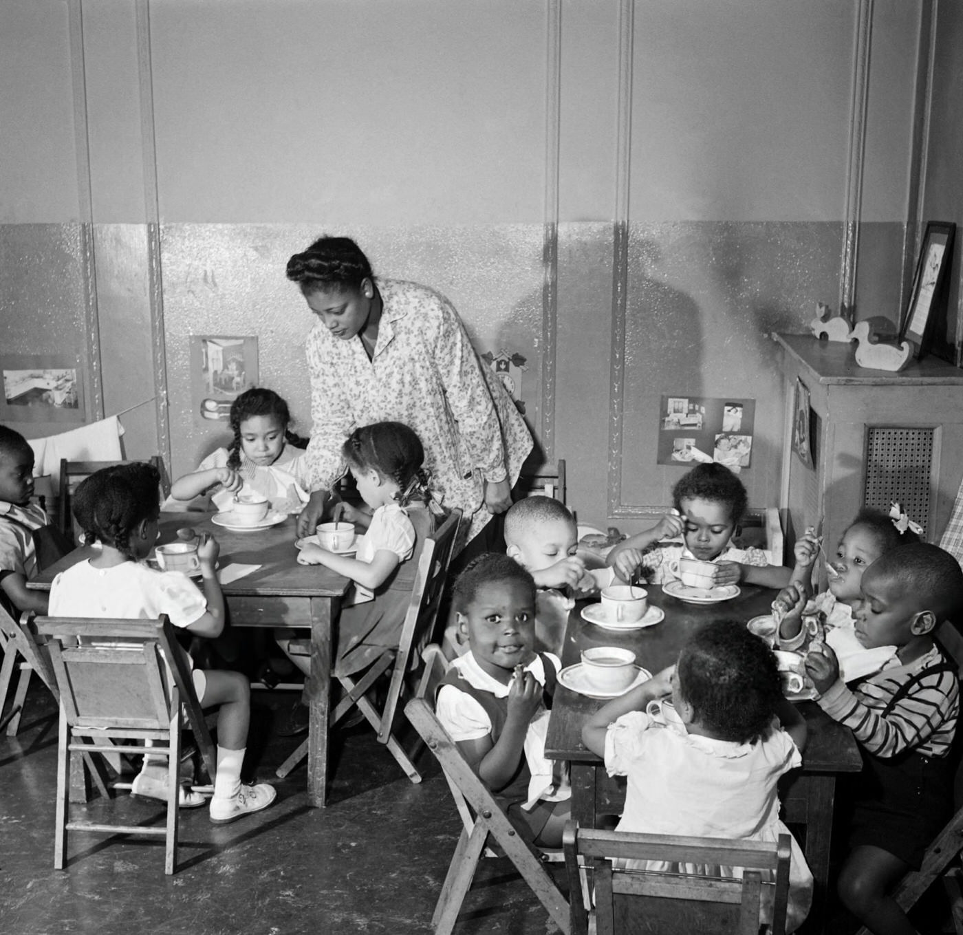 Children eat in a school canteen in Harlem, Manhattan, 1946.