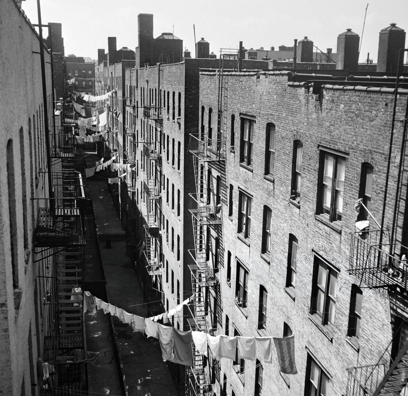 A street of Harlem, with laundry hanging from one building to another, 1946.